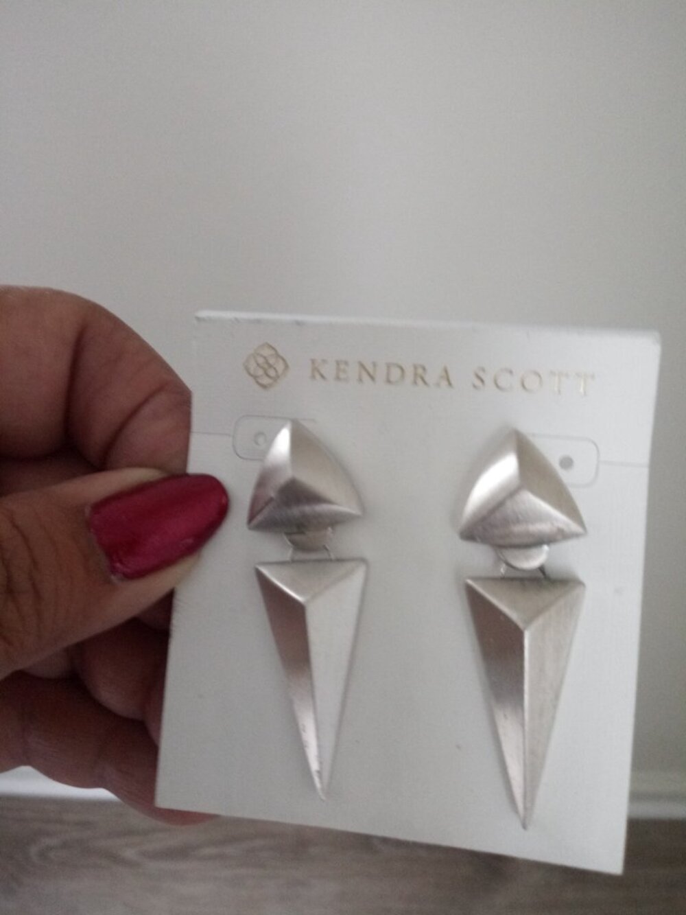 Kendra Scott silver tone drops earrings on card